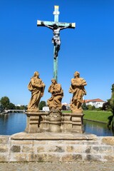 statues on oldest historic stone bridge in Pisek town