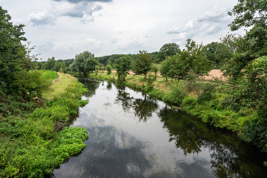 Nature reflections in a creek of the River Niers, North Rhine Westphalia, Germany