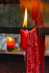 Red praying buddhist candles in park in Zhuji, China
