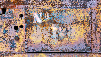 Industrial grunge rusty metal background texture with faded yellow and red paint 