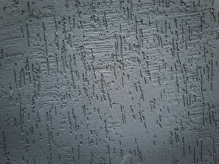Close up shot of the textured paint on the wall. Background