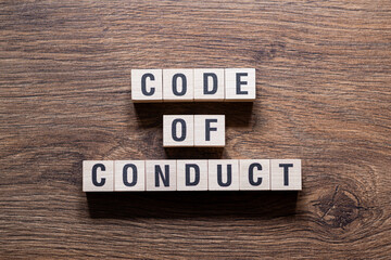 Code of conduct - word concept on building blocks, text