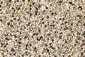 Brightly colored polystyrene beads texture as full-frame background. Colorful bright background, multi-colored balls. Sweet nice background candy