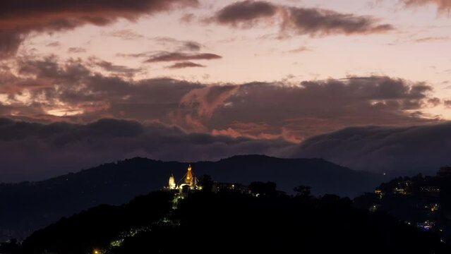 Ending day 4K sunset time lapse of incredible clouds moving waves over Swayambhunath tample in Kathmandu, Nepal. Beauty in Nature, traveling, buddhism culture, architekture concept 4K video.