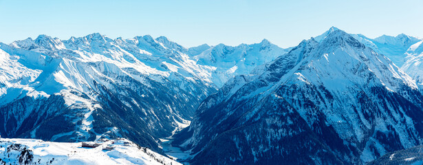 View into the Zillertal valley with the Penken ski resort in the foreground and the mountain...