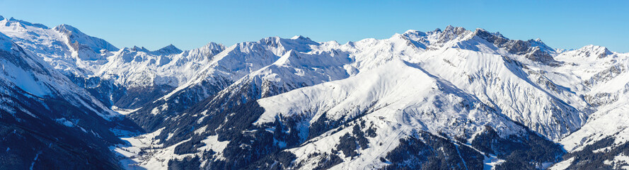 Panorama view from the Penken Mountain, Mayrhofen ski resort , into the Tuxer Valley and to the Hintertuxer Glacier ski resort. In the Valley the villages Finkenberg and Lanersbach 