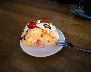 Delicious meringue roll dessert on a plate. Food