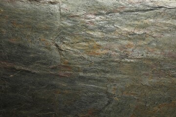 Texture of grey stone surface as background, closeup