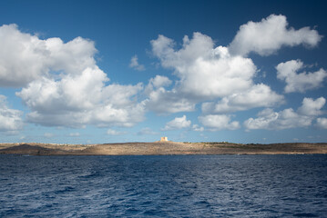 View of the island of Gozo in Malta on the horizon. In front the smaller island of Comino. There...