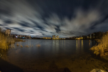 Horizon, mountain, sky, stars, water - scenic nature in darkness and light.