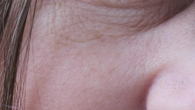 Close-up of eye of middle-aged woman with wrinkles on eyelids, Embracing Aging concept, Aging Eyes' Skin, Women's Health, Capturing Age-Related Changes