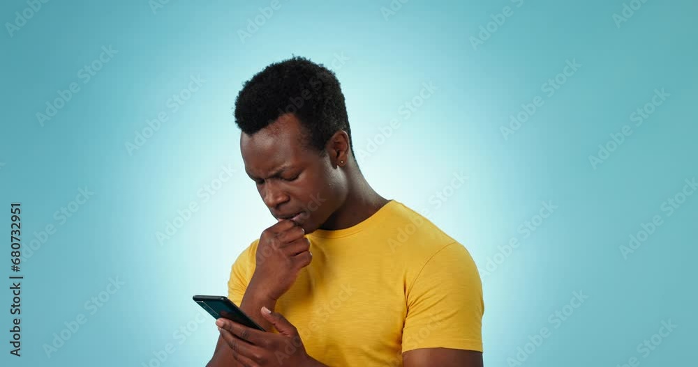 Poster phone, stress and anxiety with an annoyed black man in studio on a blue background for communication
