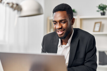 Fototapeta na wymiar student man office job online education freelancer computer using african american laptop