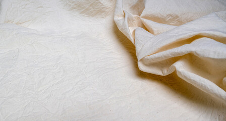 Obraz na płótnie Canvas Wrinkled white linen cloth, empty, close-up, background image