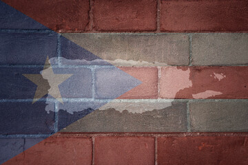 map and flag of puerto rico on a old brick wall