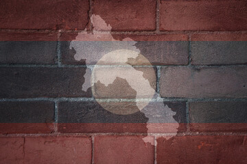 map and flag of laos on a old brick wall