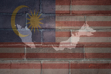 map and flag of malaysia on a old brick wall