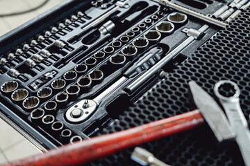 Fototapeta premium Tools and toolbox on the showcase. Many wrench and nuts in toolkit sets