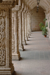 Perspective of carved columns in the Cloister of the La Compania Church, Arequipa, Peru. 17th...