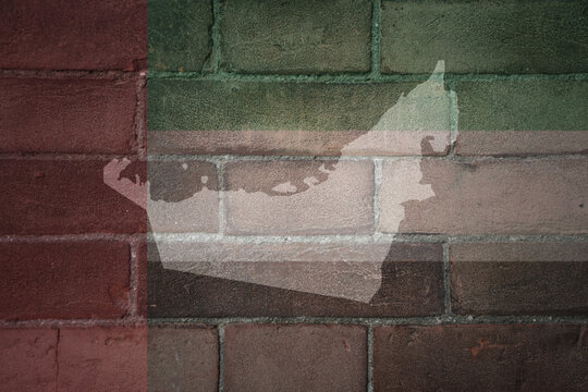 map and flag of united arab emirates on a old brick wall
