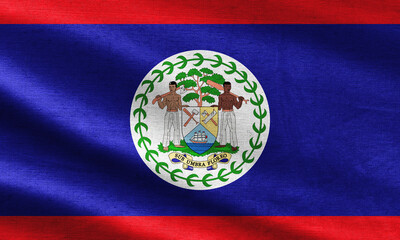 Belize flag pattern on the fabric texture ,vintage style. Close up waving flag of belize symbols