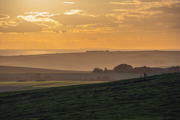 View of the South Downs and the English Channel on an autumn evening, East Sussex, England