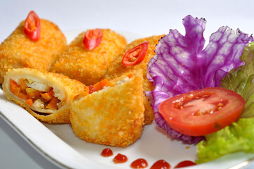 Picture of Risoles spring rolls filled with vegetables, typical Indonesian snack menu, taking pictures with decoration and artistic value, food photography