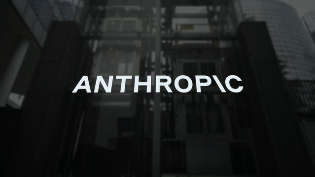 Anthropic logo on the building window, artificial intelligence ANTHROPIC brand on a wall.