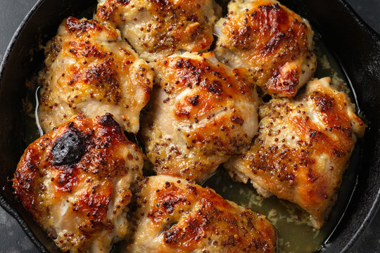 Baked Honey mustard chicken thighs in iron cast pan