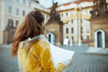 Afwasbaar Fotobehang Praag Seen from behind woman in blouse in Prague Czech Republic