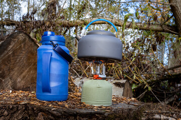 Kettle on stove heating up water outdoors