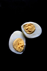 Photo of cooked boiled chicken eggs on the kitchen table ready to be served for breakfast or dinner