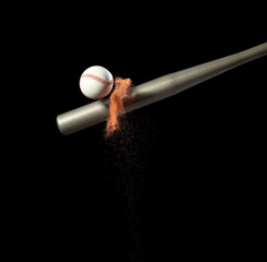Baseball player hit ball with silver bat and sand soil explode in air. Baseball players in dynamic action hit ball smoke tail. Black background isolated freeze action