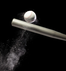 Baseball player hit ball with silver bat and sand soil explode in air. Baseball players in dynamic action hit ball smoke tail. Black background isolated freeze action