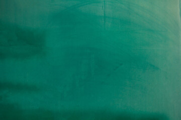 Background of old green wall. English letters on a green background