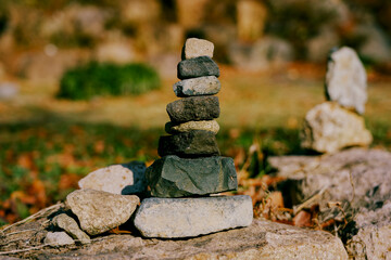 A stone tower built with pebbles while making a wish on top of a rock