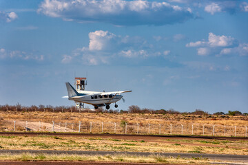small airport, passenger plane taking off, control tower