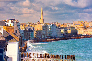 Sunny aerial view of beautiful walled port city of Saint-Malo at high tide, Brittany, France