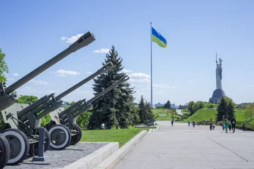 Deurstickers Exhibition of combat machinery and huge ukrainian flag pole in capital kyiv © Yuichi Mori