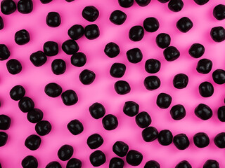 black chocolate candy in pink and black.