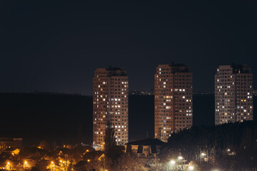 Fototapeta na wymiar city skyline at night general view of Illuminated high-rise apartment buildings in Kyiv