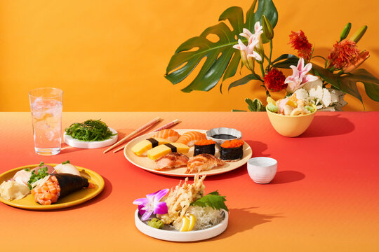Sushi Wonderland tropical vibes with flower arrangement