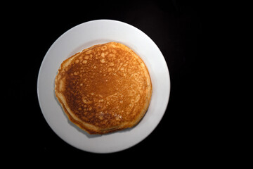 Traditional Hot Cake with black background and space for advertising text