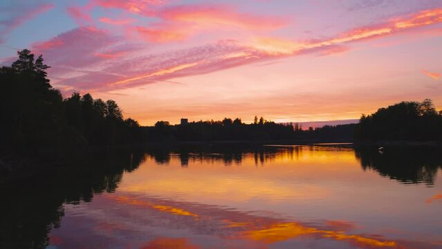 Panning shot over Ottenstein reservoir at sunset, Ottenstein, Lower Austria, Austria, Europe
