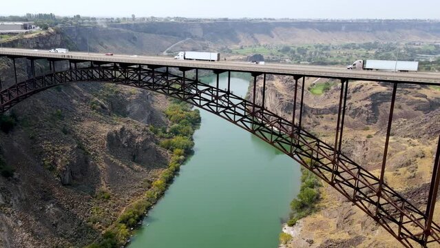 Aerial view of the Perrine Memorial Bridge over the snake river in Twin Falls, Idaho. With cars driving across the bridge.