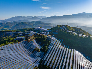 Aerial photography of solar photovoltaic panels on the mountain