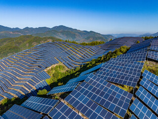 Aerial photography of solar photovoltaic panels on the mountain