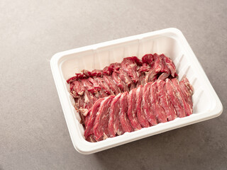 Fresh raw meat in disposable containers