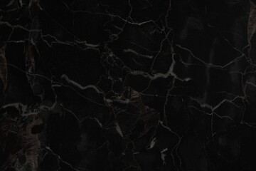 Black marble surface as background, closeup view