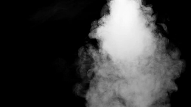 Closeup of white smoke on the black background